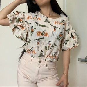 cute tshirt with ruffle sleeves, printed with sunbathers, surfers, and yogis